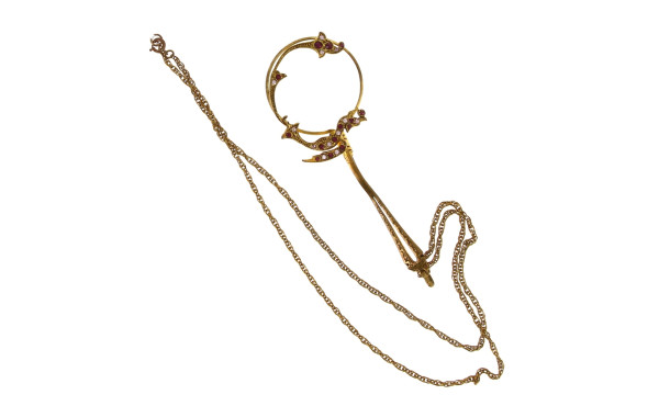 Petite loupe en métal doré et strass sur