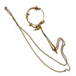 Petite loupe en métal doré et strass sur