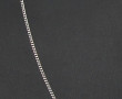 Chaîne en or gris 18 cts, poinçon tête d