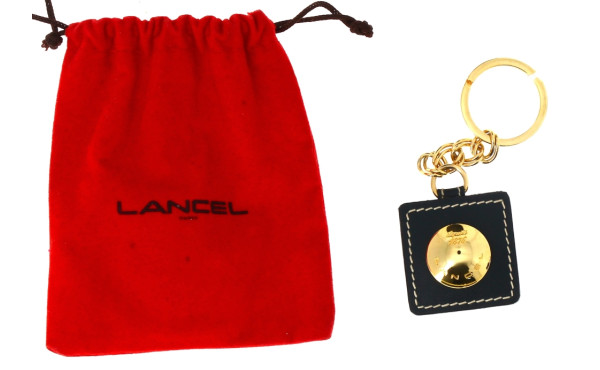 LANCEL - Porte-clé en métal doré et cuir