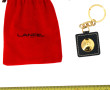 LANCEL - Porte-clé en métal doré et cuir