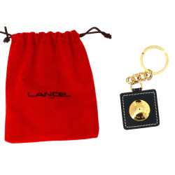 LANCEL - Porte-clé en métal doré et cuir