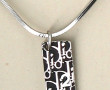 DIOR - Pendentif en métal sur chaîne mét