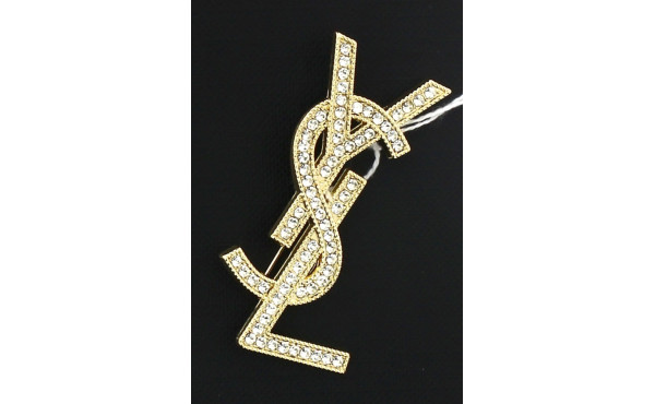 YVES SAINT-LAURENT - Broche YSL en métal