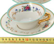 4 tasses et 4 sous-tasses en porcelaine 