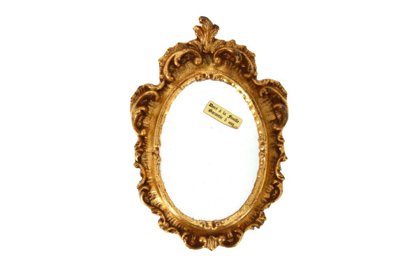 Petit miroir de style rocaille doré à la