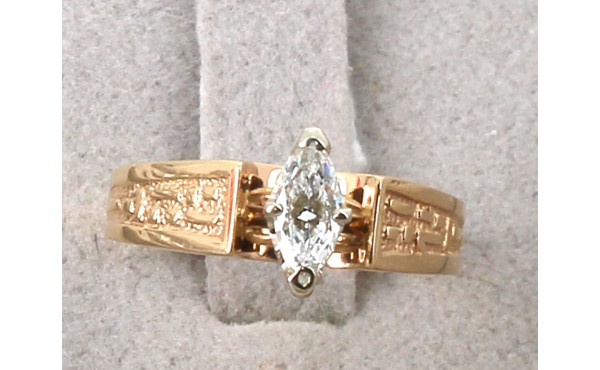 Bague en or jaune travaillé 18 cts serti