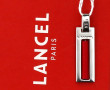 LANCEL - Pendentif en métal argenté et c