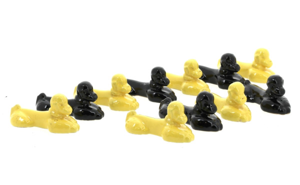 Suite de 11 porte-couteaux en faïence en