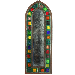 Miroir de forme ogivale en fer forgé et 