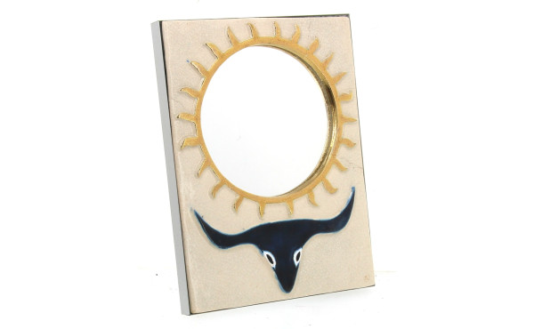 Miroir en céramique à décor d'un soleil 