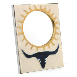 Miroir en céramique à décor d'un soleil 