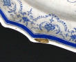 Plat ancien en faïence à bords contours,