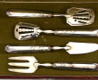 4 petits couverts à hors-d'œuvre en méta