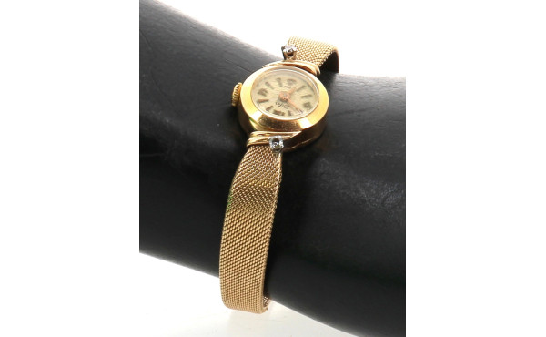 Montre bracelet de dame en or jaune, poi