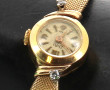 Montre bracelet de dame en or jaune, poi