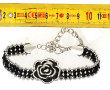 Bracelet en métal et perles noires à mot