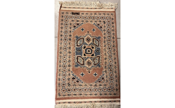 Petit tapis laine points noués dans les 