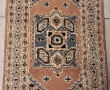 Petit tapis laine points noués dans les 