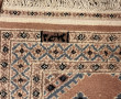Petit tapis laine points noués dans les 