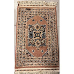 Petit tapis laine points noués dans les 