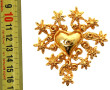 Christian Lacroix, Broche en métal doré 
