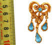 Christian Lacroix, broche en métal doré 