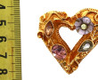 Christian Lacroix, broche en métal doré,