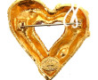 Christian Lacroix, broche en métal doré,
