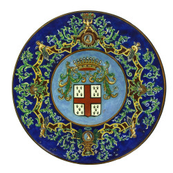 Plat à ombilic en faïence à décor d'armo