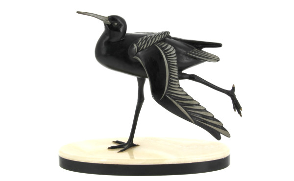 "Oiseau" sujet en régule reposant sur un