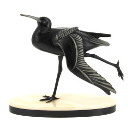 "Oiseau" sujet en régule reposant sur un