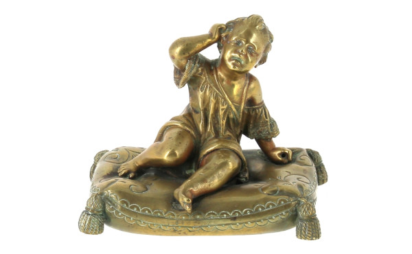 "Enfant au coussin", presse-papier en br