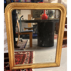 Miroir doré fin XIXe décor de frise à la
