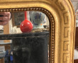 Miroir doré fin XIXe décor de frise à la