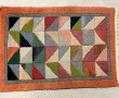 Lot de 4 petits tapis en laine à décor g