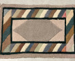 Lot de 4 petits tapis en laine à décor g