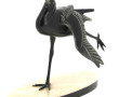 "Oiseau" sujet en régule reposant sur un