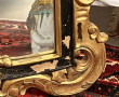 Miroir rocaille noir et or dans le goût 