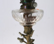 Lampe à pétrole ancienne à piètement en 