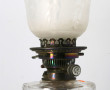 Lampe à pétrole ancienne à piètement en 