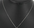 Pendentif en or gris 750ème et émeraude,