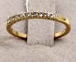 1/2 alliance en or 18 cts sertie de peti