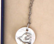 NINA RICCI - Pendentif façon nacre sur c