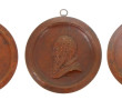 Trois médaillons en bronze à patine brun