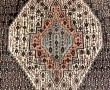 Tapis en laine points noués dans les ton
