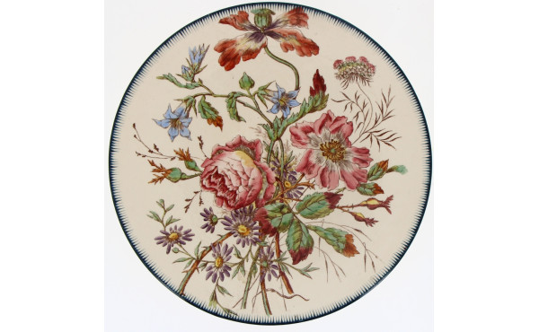 Plat rond ancien en faïence finé à décor
