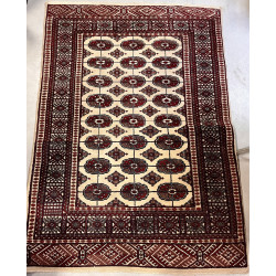 Tapis en laine dans les tons beige et ro