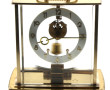 Pendule squelette en laiton, mouvement é