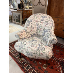 Fauteuil crapaud recouvert d'un tissu fl
